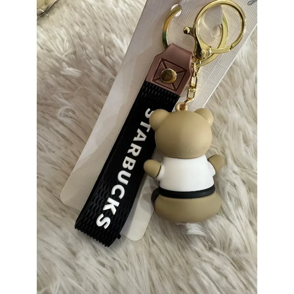 Starbucks bear black keychain with white sash and black Starbucks logo